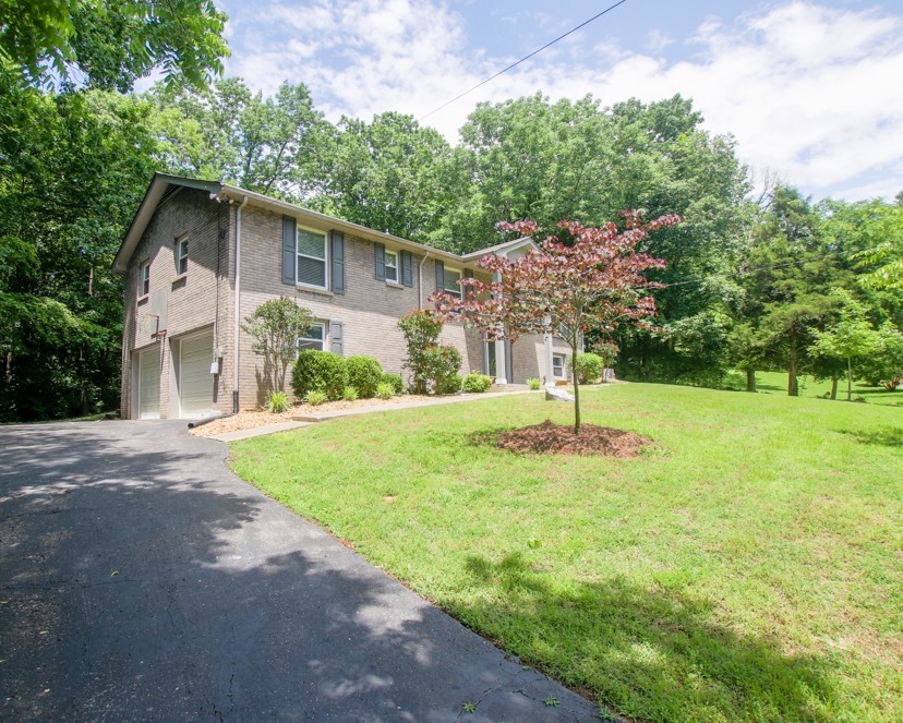 590 Weeping Elm Road Mount Juliet, TN 37122 - Photo 2 of 20 a house with trees in the background