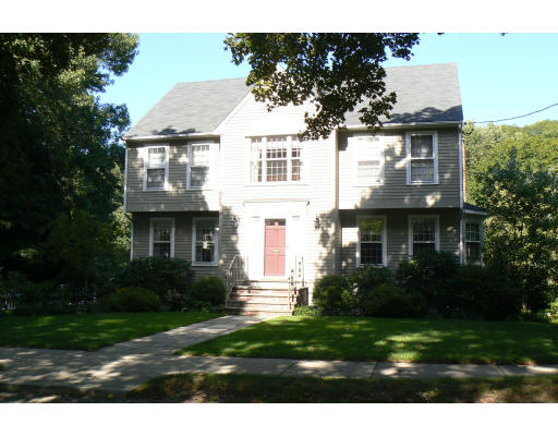 54 Ridge Avenue Newton, MA 02459 - Photo 1 of 20 a front view of a house with a garden