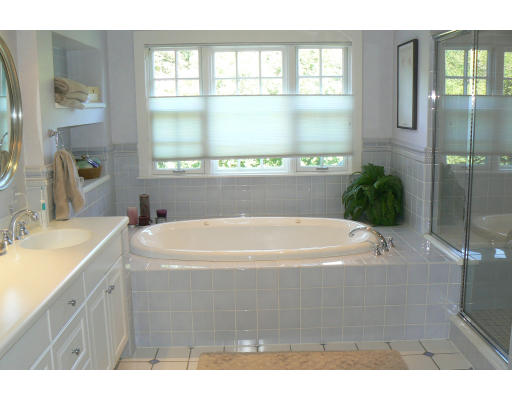 54 Ridge Avenue Newton, MA 02459 - Photo 12 of 20 a white bath tub sitting next to a bathroom sink