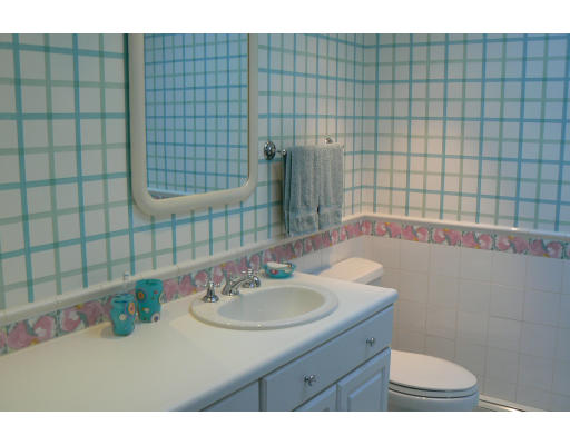 54 Ridge Avenue Newton, MA 02459 - Photo 18 of 20 a bathroom with a sink a toilet and shower