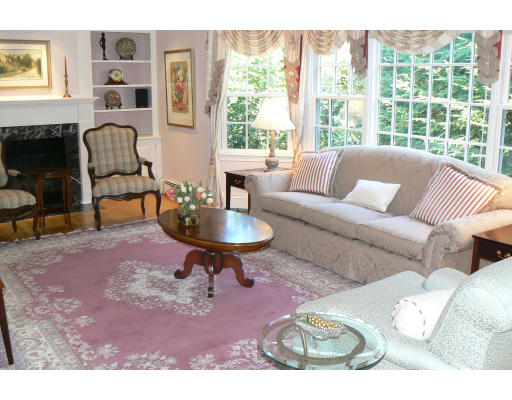 54 Ridge Avenue Newton, MA 02459 - Photo 4 of 20 a living room with furniture and a fireplace