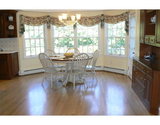 54 Ridge Avenue Newton, MA 02459 - Photo 9 of 20 a view of a dining room with furniture and windows