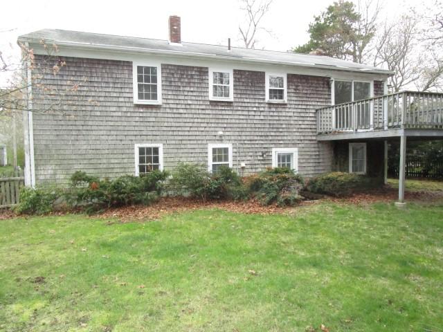 82 Megan Road Hyannis, MA 02601 - Photo 14 of 16 a front view of a house with a yard