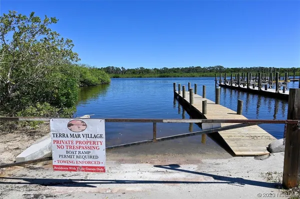 a view of a wooden deck with lake view