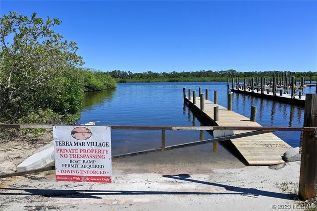 a view of a wooden deck with lake view