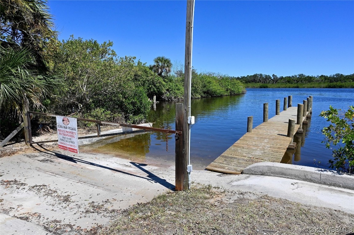 4339 Cedar Way Edgewater, FL 32141 - Photo 10 of 16 a view of a lake with houses