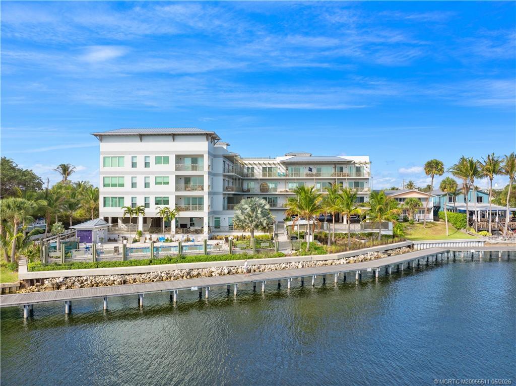 41 Southwest Seminole Street, Unit 208 Stuart, FL 34994 - Photo 1 of 46 a view of residential building with outdoor space