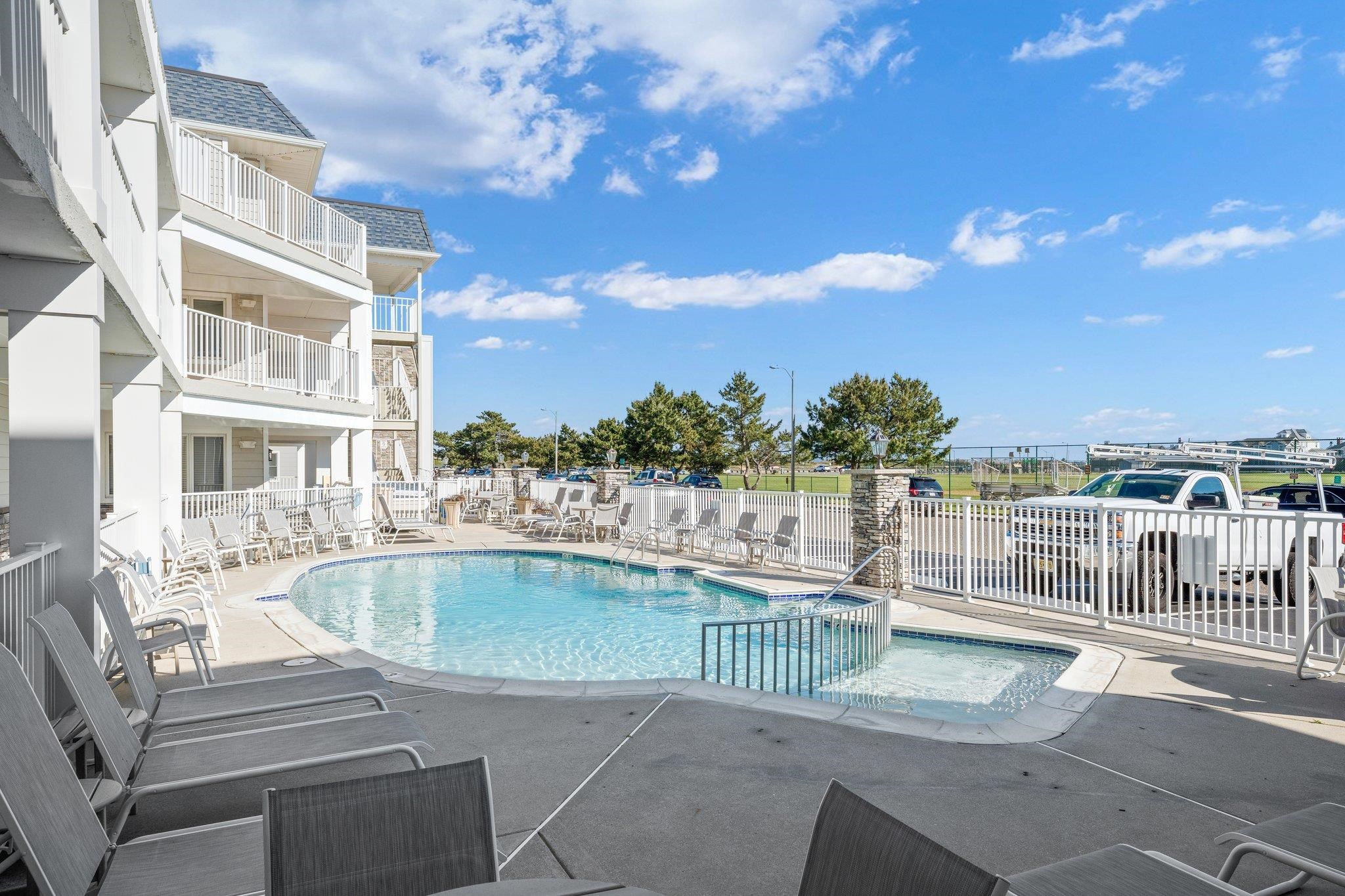 177 80th Street, Unit 304 Avalon, NJ 08202 - Photo 11 of 31 a view of a swimming pool with a terrace
