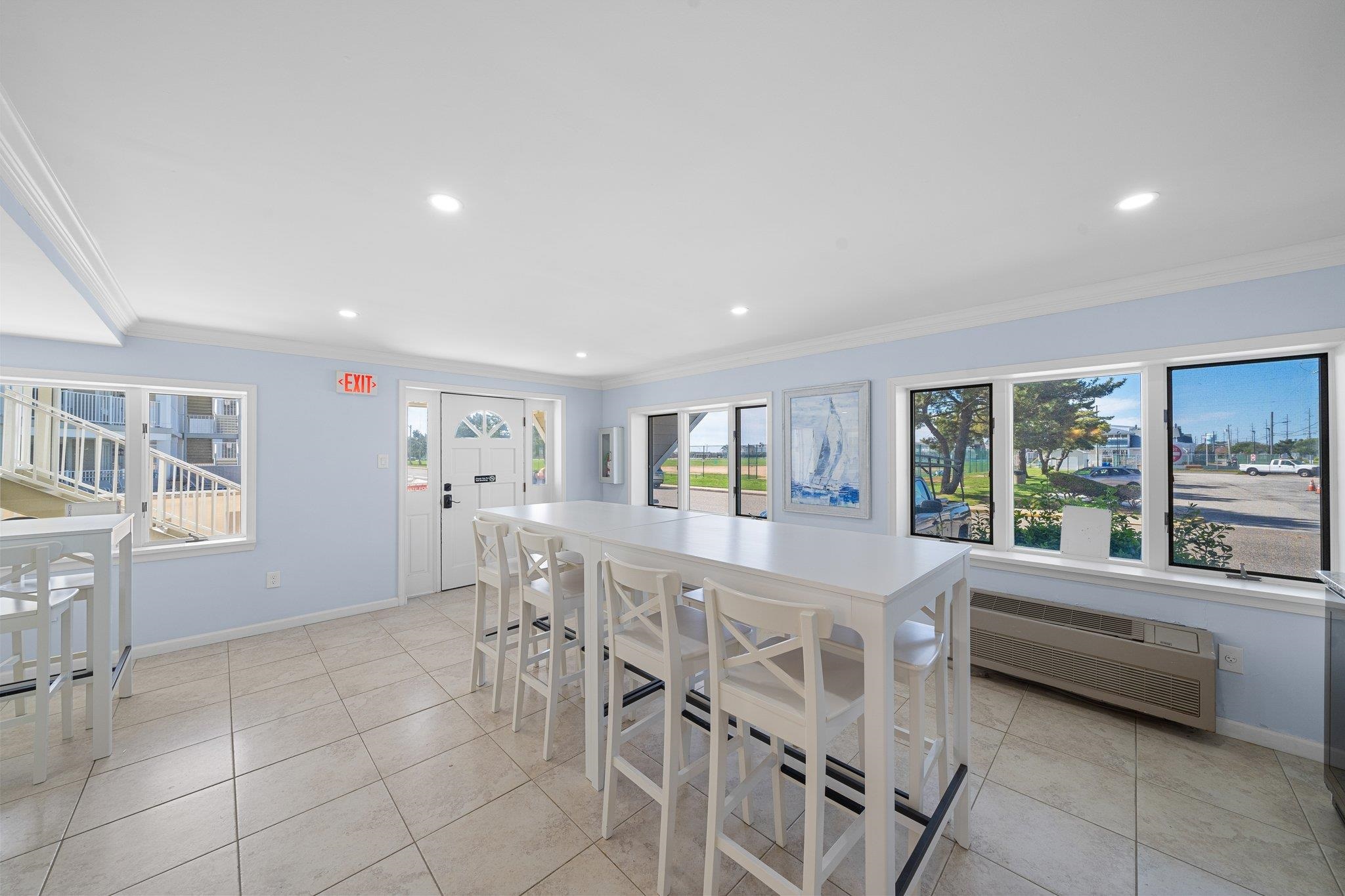 177 80th Street, Unit 304 Avalon, NJ 08202 - Photo 13 of 31 a large white kitchen with a large window