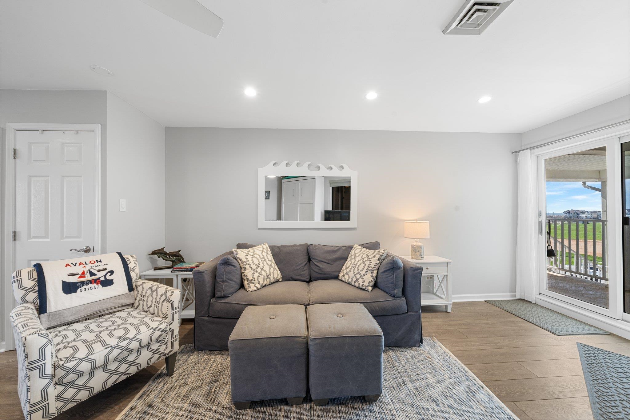 177 80th Street, Unit 304 Avalon, NJ 08202 - Photo 17 of 31 a bedroom with furniture and a window