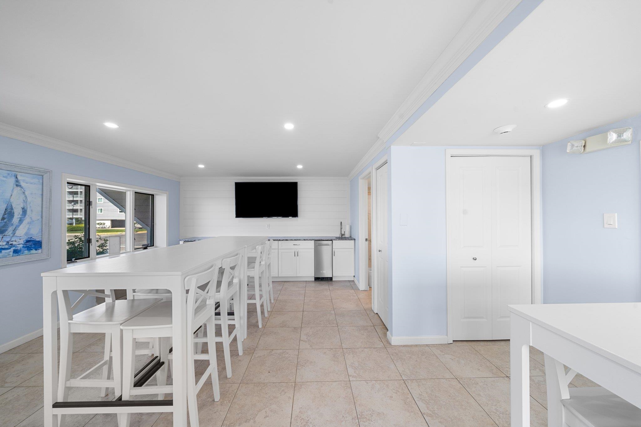 177 80th Street, Unit 304 Avalon, NJ 08202 - Photo 24 of 31 a view of kitchen with furniture and wooden floor