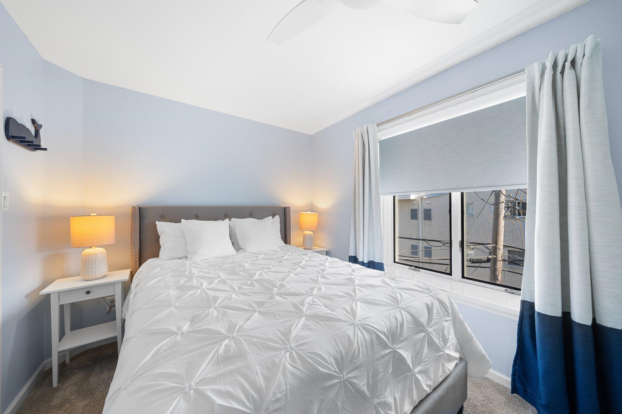 177 80th Street, Unit 304 Avalon, NJ 08202 - Photo 7 of 31 a large white bed in a white room