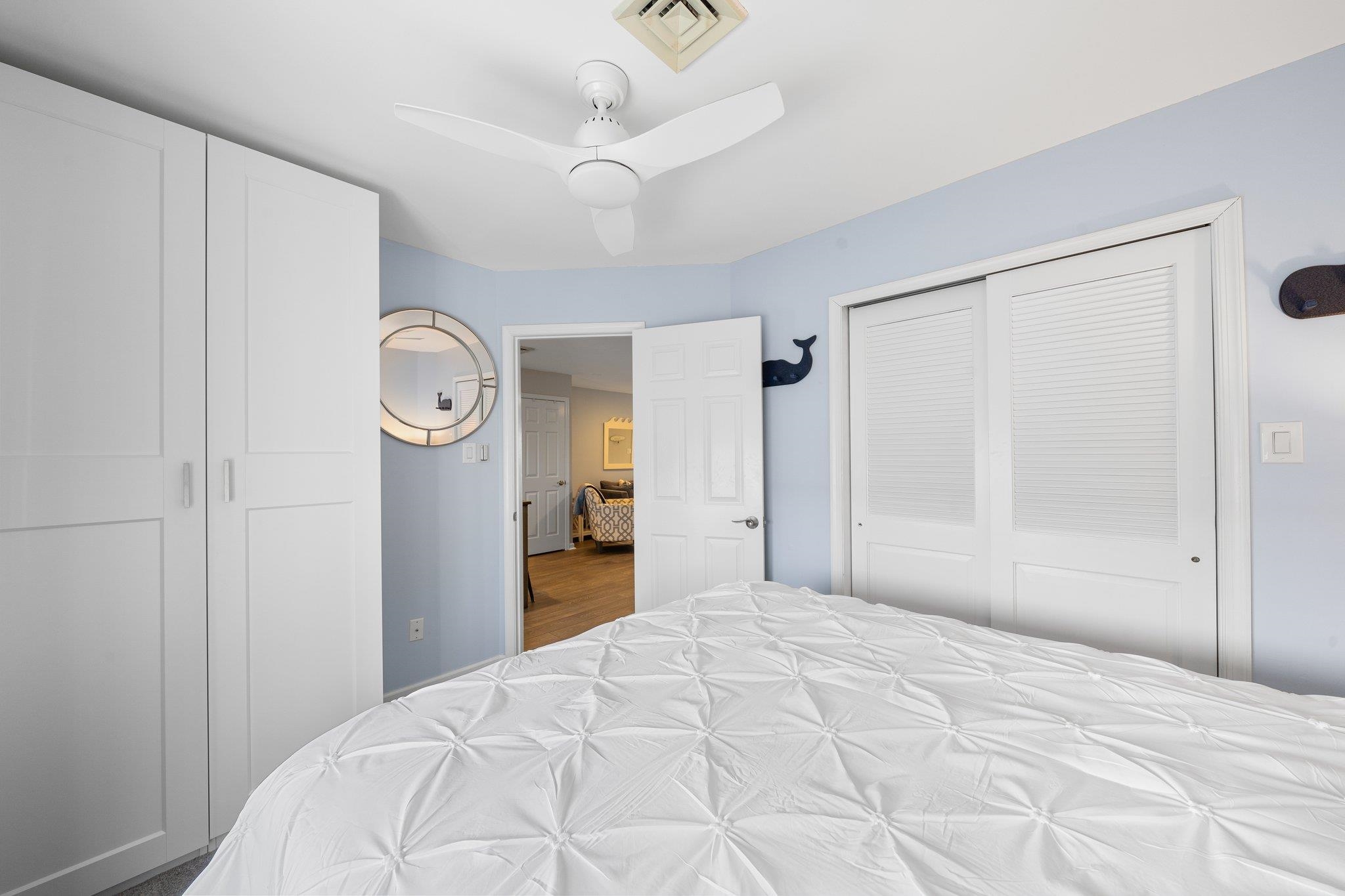 177 80th Street, Unit 304 Avalon, NJ 08202 - Photo 9 of 31 a bedroom with a bed and a window