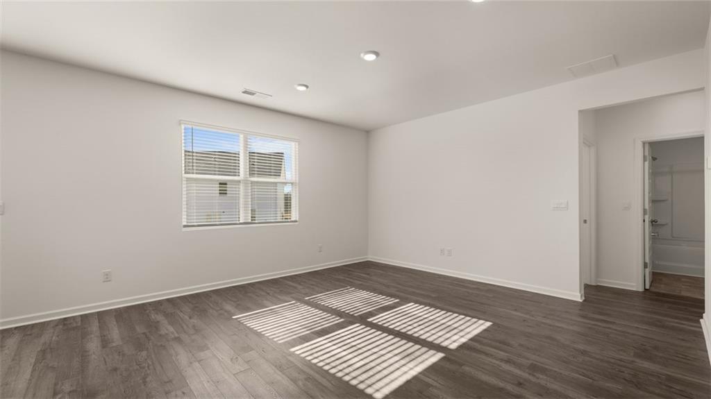 73 White Spruce Way Newnan, GA 30265 - Photo 13 of 47 a view of wooden floor in an empty room