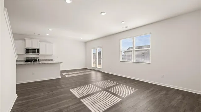 a view of kitchen with sink microwave and stove