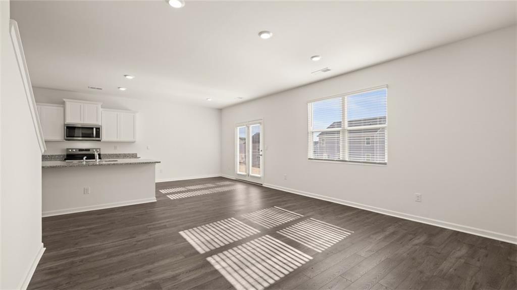 73 White Spruce Way Newnan, GA 30265 - Photo 15 of 47 a view of kitchen with sink microwave and stove