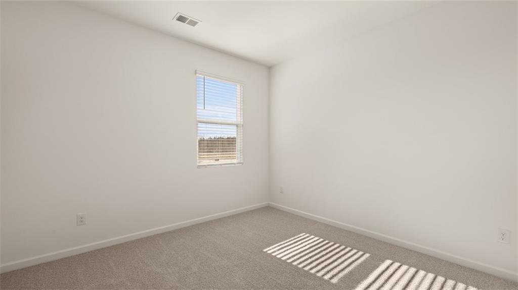 73 White Spruce Way Newnan, GA 30265 - Photo 16 of 47 a view of an empty room