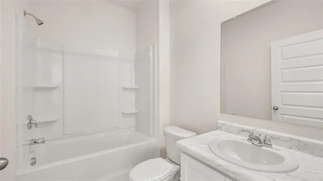 a bathroom with a sink toilet and bathtub