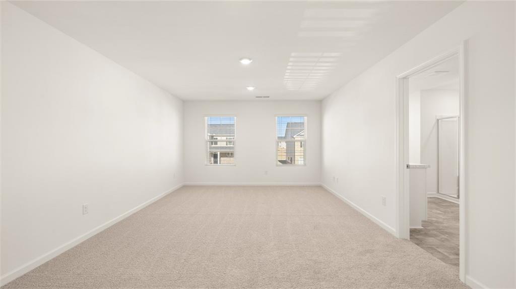 73 White Spruce Way Newnan, GA 30265 - Photo 21 of 47 an empty room with windows