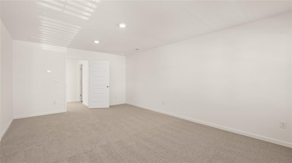 73 White Spruce Way Newnan, GA 30265 - Photo 23 of 47 a view of an empty room