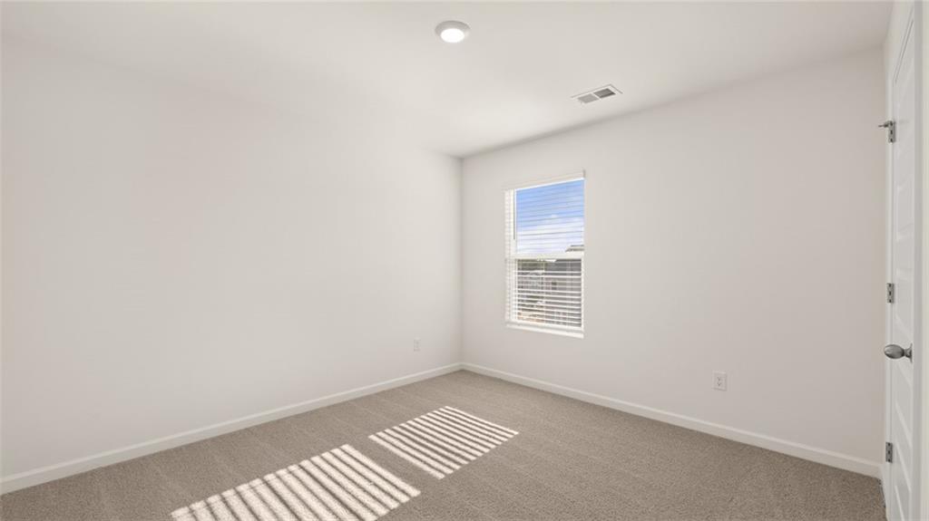 73 White Spruce Way Newnan, GA 30265 - Photo 35 of 47 a view of an empty room and a window