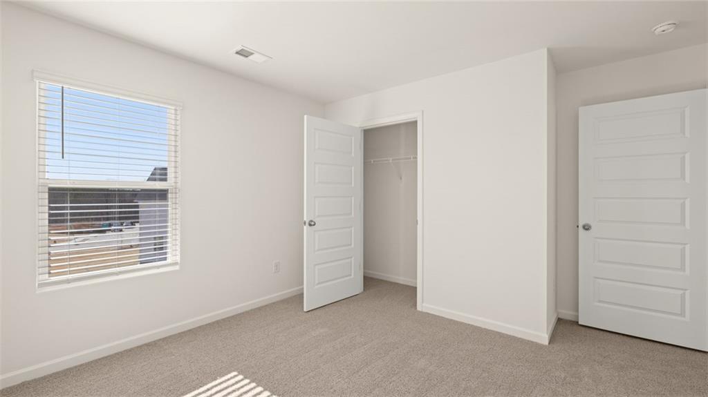73 White Spruce Way Newnan, GA 30265 - Photo 36 of 47 a view of an empty room with a window