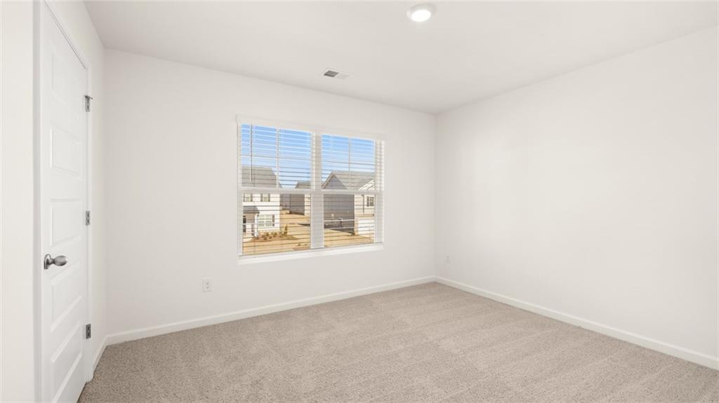 73 White Spruce Way Newnan, GA 30265 - Photo 37 of 47 an empty room with a window