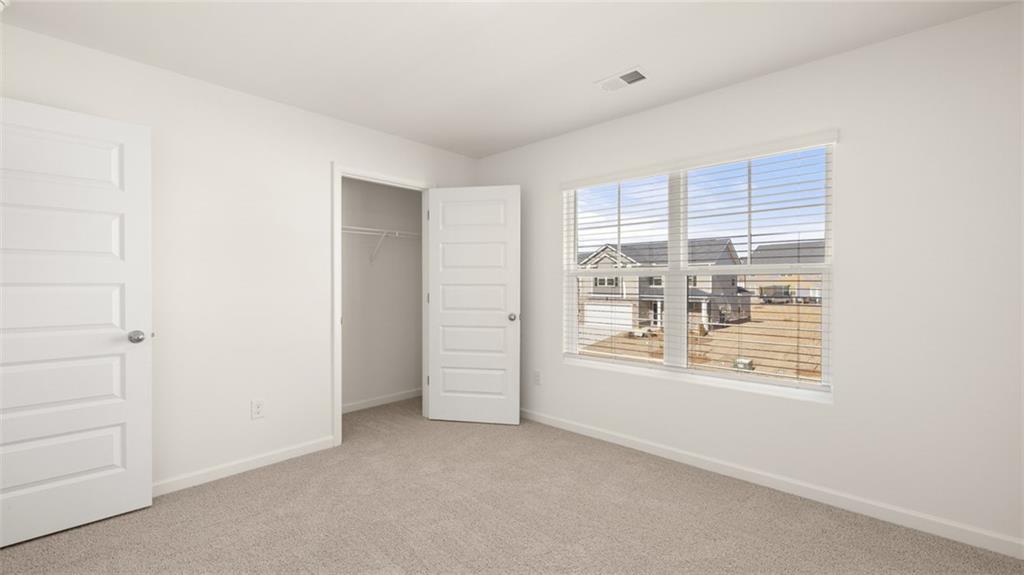 73 White Spruce Way Newnan, GA 30265 - Photo 38 of 47 a view of an empty room with a window