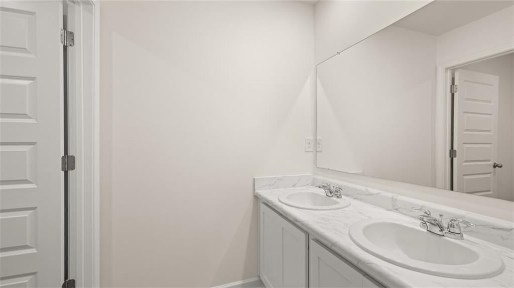 73 White Spruce Way Newnan, GA 30265 - Photo 39 of 47 a bathroom with a sink and a mirror