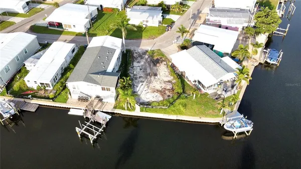 an aerial view of a house with pool patio fire pit and outdoor space