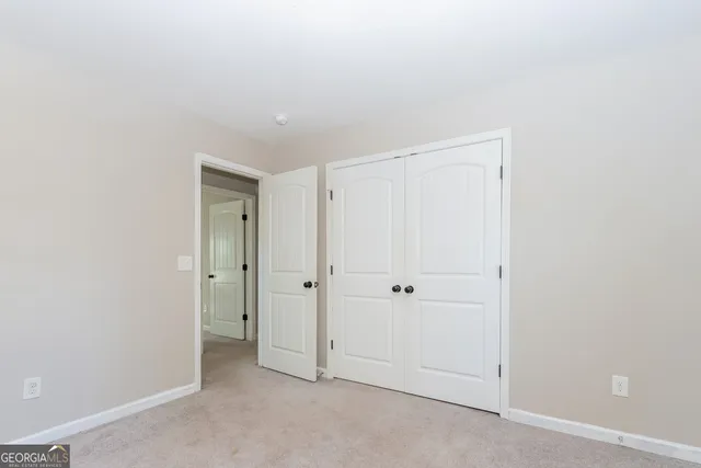 a living room with a flat screen tv and a fireplace