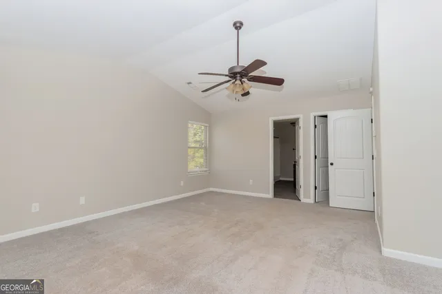 a bathroom with a granite countertop sink and a bathtub