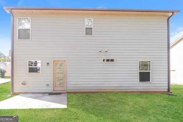 a view of a backyard of the house