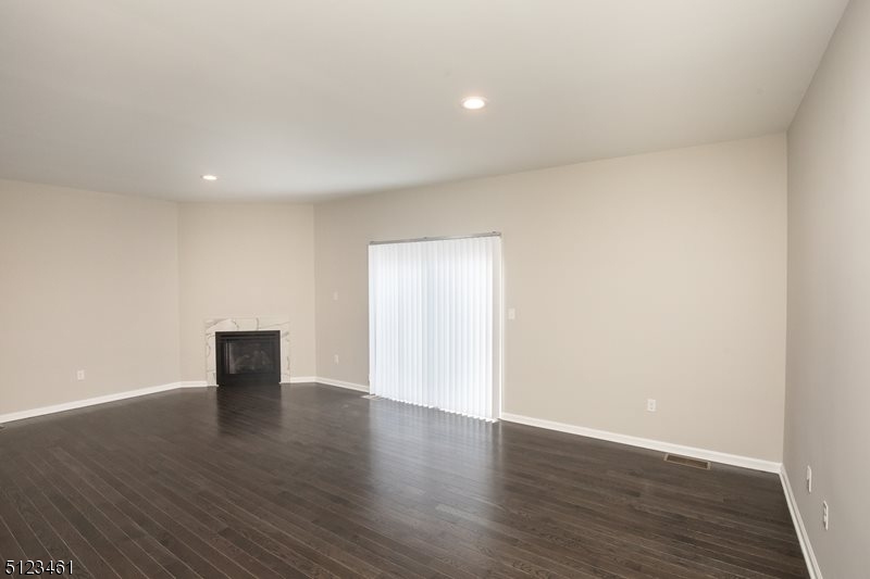 96 Arlene Court Morris Plains, NJ 07950 - Photo 14 of 24 a view of an empty room with wooden floor