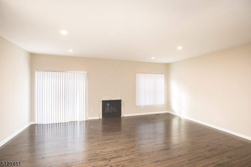 96 Arlene Court Morris Plains, NJ 07950 - Photo 15 of 24 a view of an empty room with wooden floor and a window