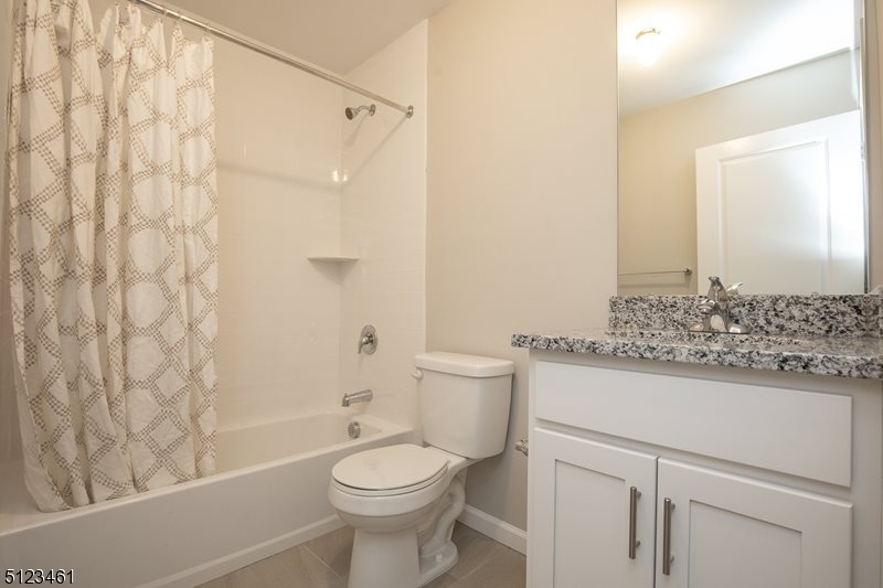96 Arlene Court Morris Plains, NJ 07950 - Photo 19 of 24 a bathroom with a granite countertop sink a toilet and shower