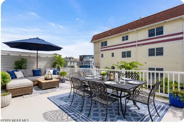 a view of a patio with furniture