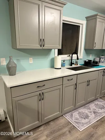 a kitchen with a sink and cabinets