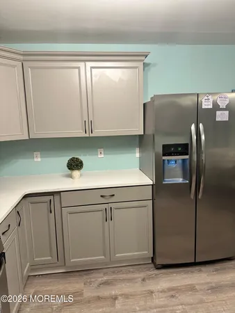 a kitchen with cabinets and stainless steel appliances