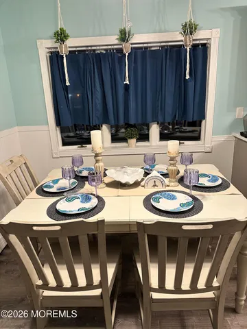 a view of a dining room with furniture