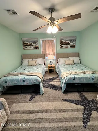a bedroom with bed and window