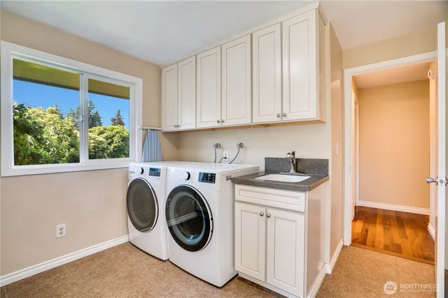a utility room with dryer and washer