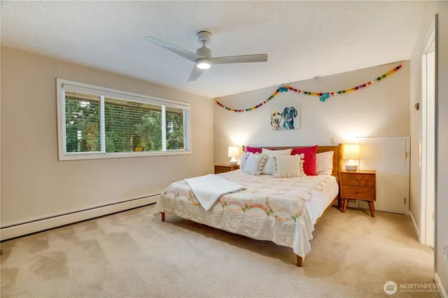 a bedroom with a bed and window