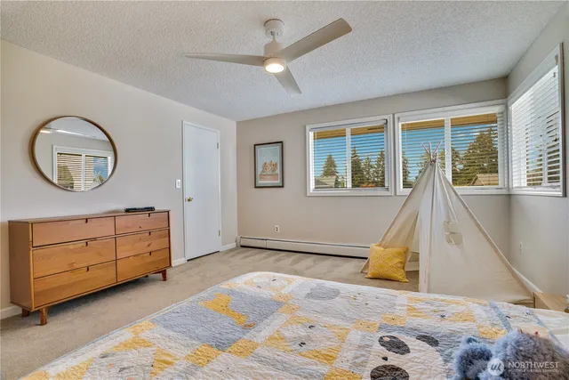 a view of a livingroom with furniture and a window