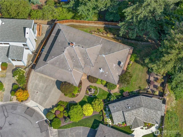 a balcony with wooden floor table and chairs