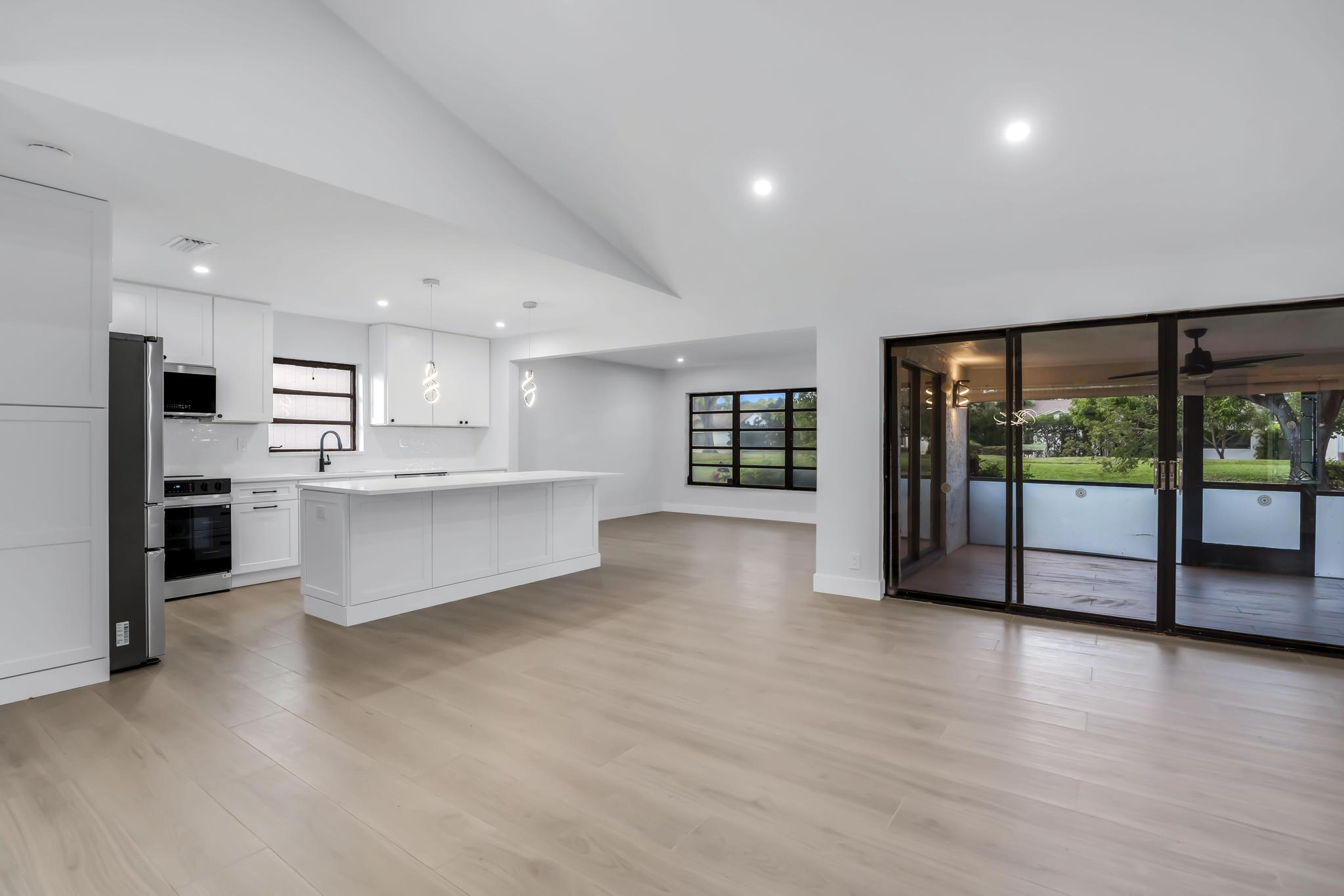 18089 103rd Trail South Boca Raton, FL 33498 - Photo 13 of 51 a view of a kitchen with large windows