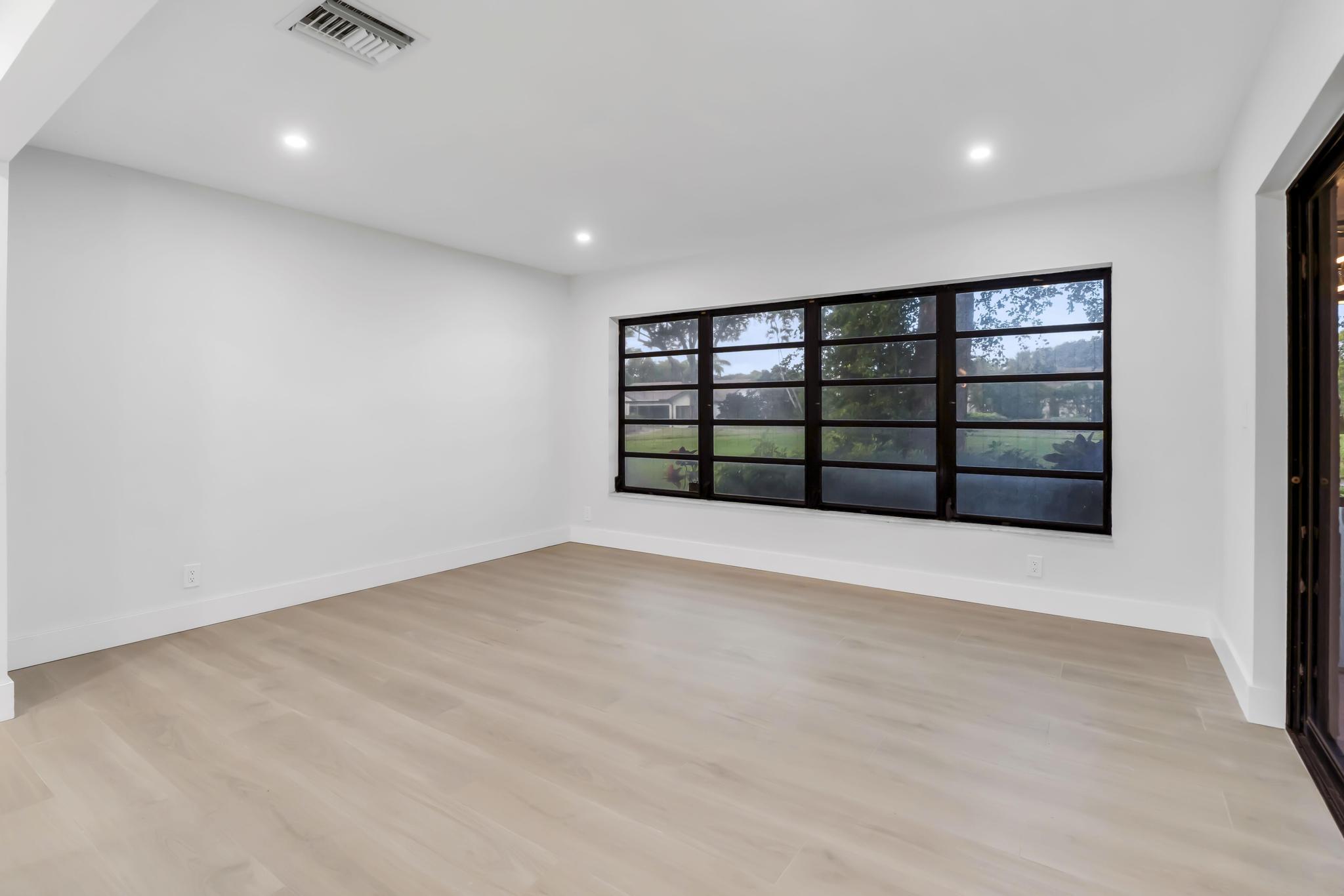 18089 103rd Trail South Boca Raton, FL 33498 - Photo 20 of 51 wooden floor in an empty room with a window