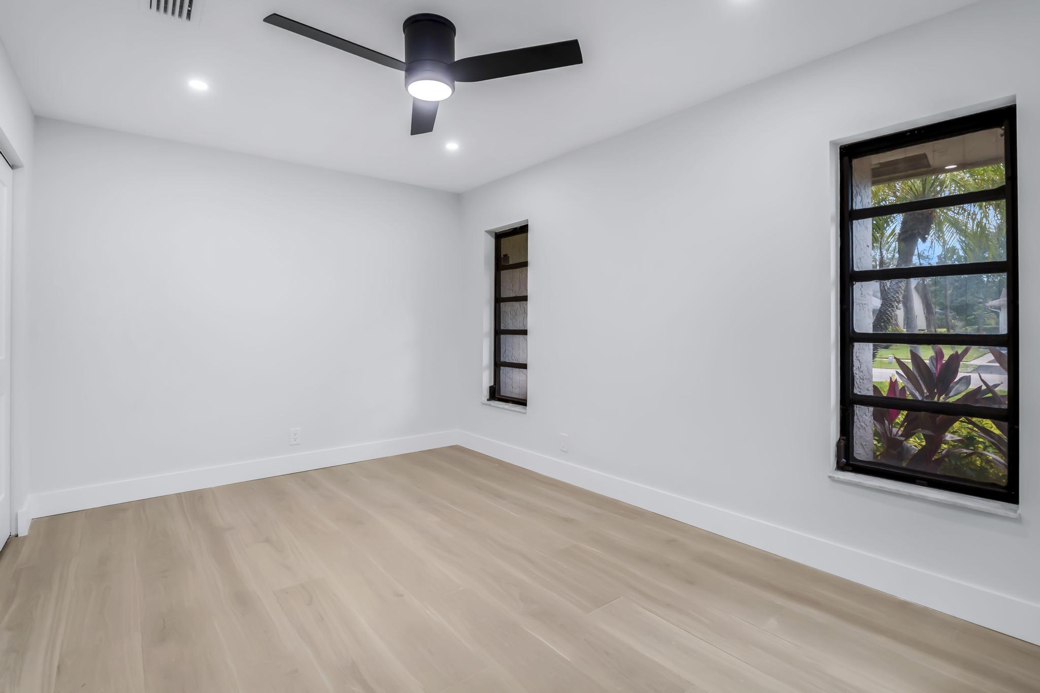 18089 103rd Trail South Boca Raton, FL 33498 - Photo 23 of 51 an empty room with painting on the wall