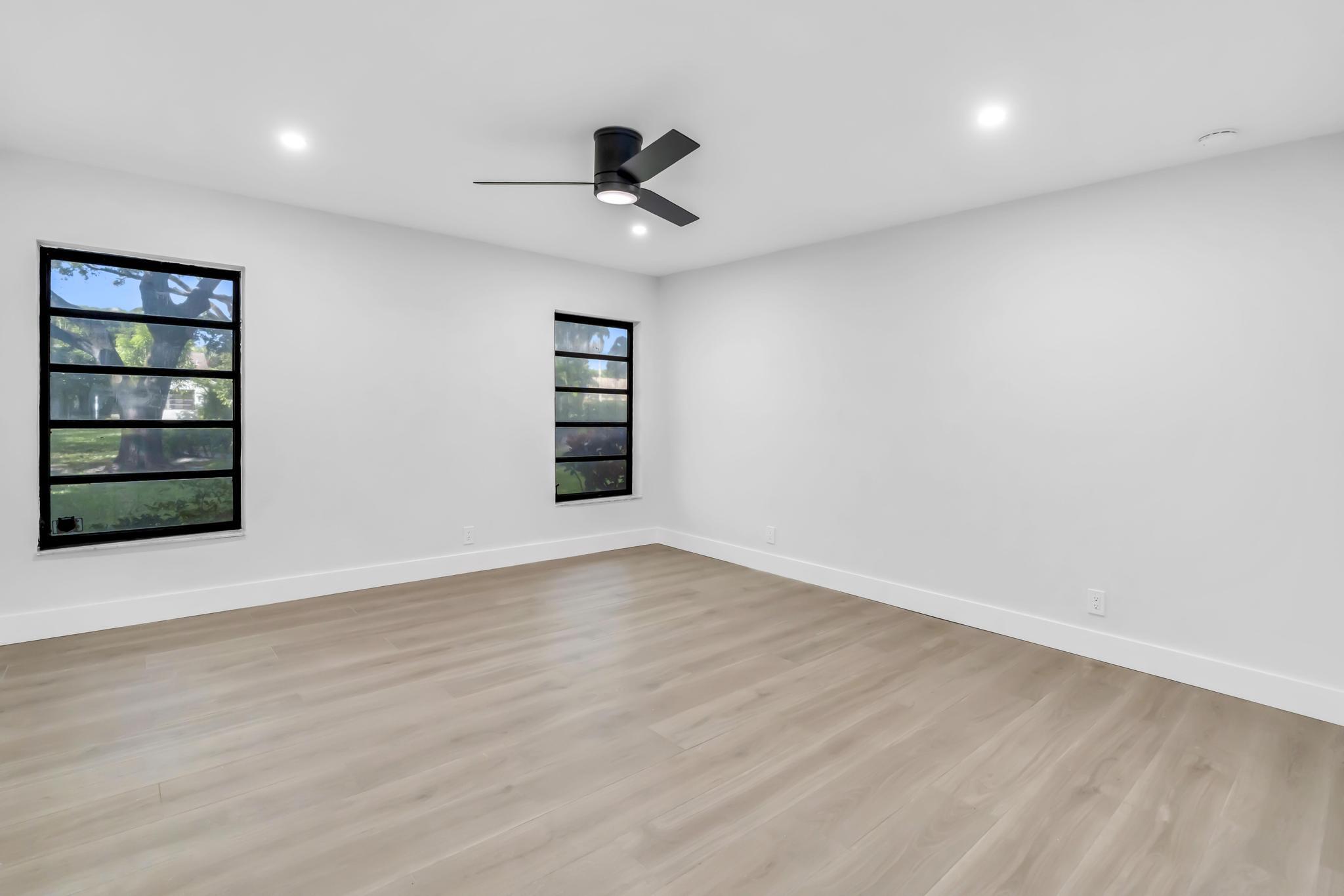 18089 103rd Trail South Boca Raton, FL 33498 - Photo 29 of 51 an empty room with cabinet and windows