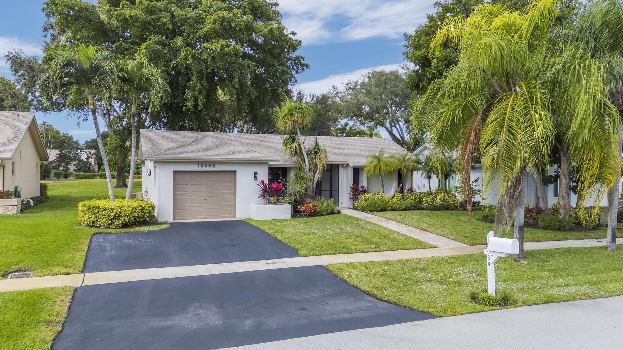 18089 103rd Trail South Boca Raton, FL 33498 - Photo 3 of 51 a view of a house with a yard and tree s